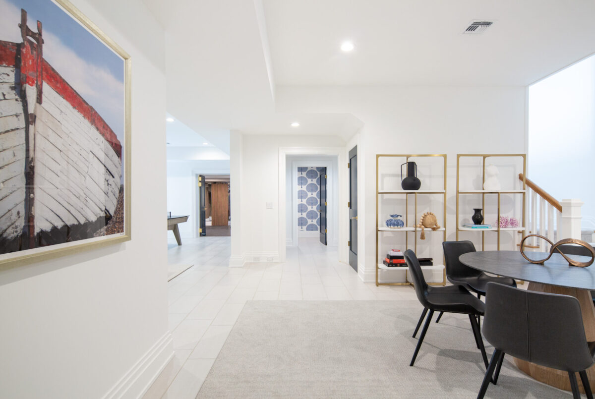 Game Table With View To Gym & Powder Room – Lower Level