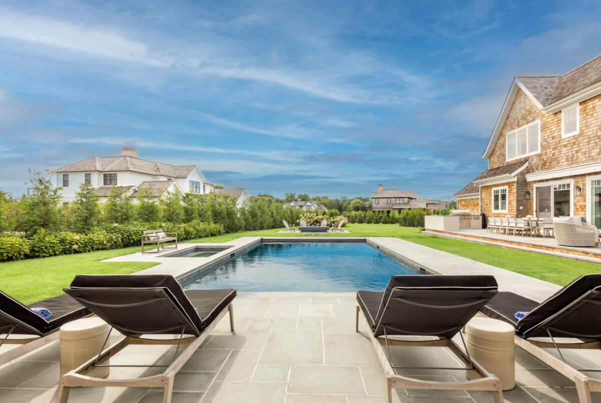 Swimming Pool With Chaise Lounges – Backyard