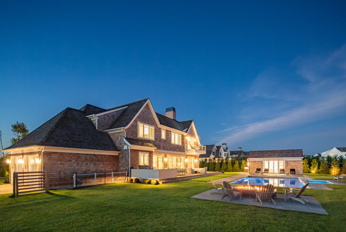 Fireplace, Terrace & Pool House At Dusk – Backyard